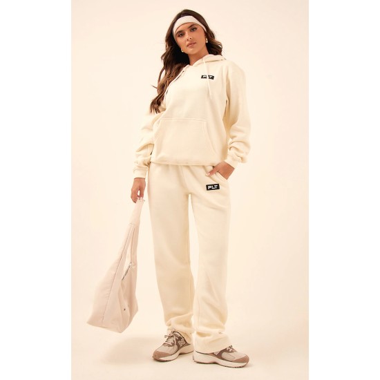 PRETTYLITTLETHING Cream Logo Badge Detail Straight Leg Sweatpants PRETTYLITTLETHING Cream Logo Badge Detail Straight Leg Sweatpants
