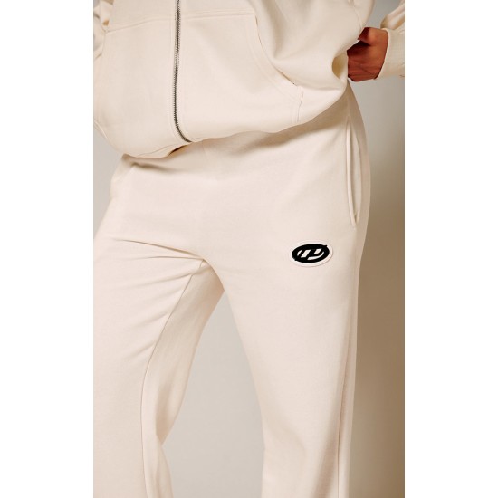 PRETTYLITTLETHING Cream Contrast Logo Badge Wide Leg Sweatpants PRETTYLITTLETHING Cream Contrast Logo Badge Wide Leg Sweatpants